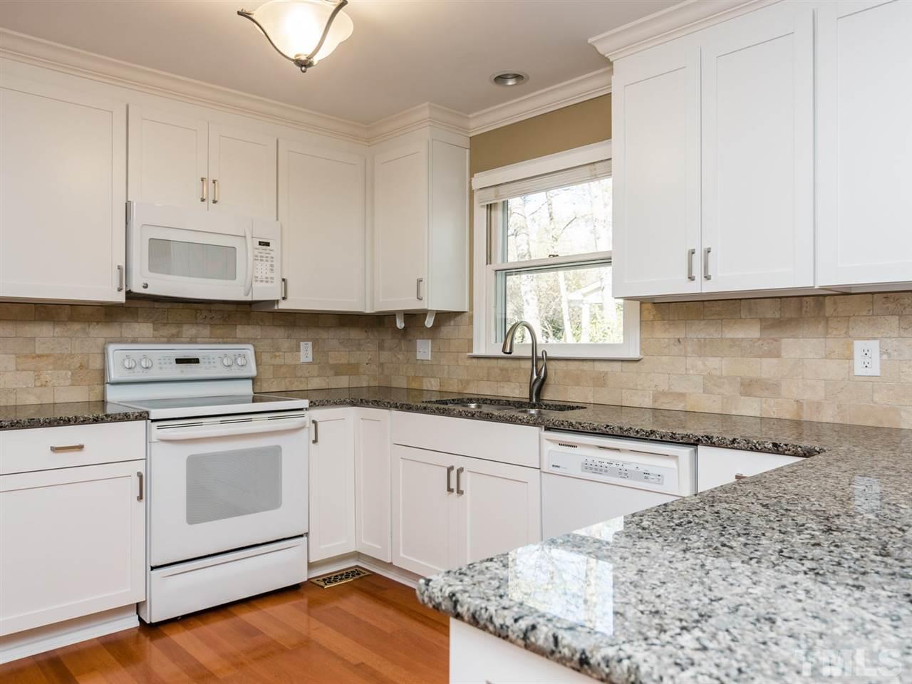 112 Trackers Road Cary, NC 27513 - Photo 8 of 25 This well-appointed kitchen will be a joy to cook in. The tile back splash completes the package.