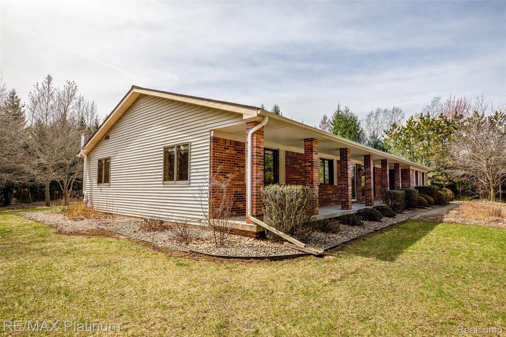 909 Chase Lake Road Howell, MI 48855 - Photo 2 of 37 Check out the nice brick pillars on front porch!