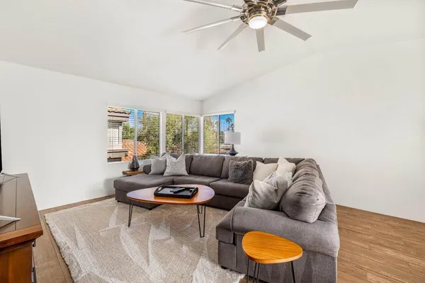 a living room with furniture and a window