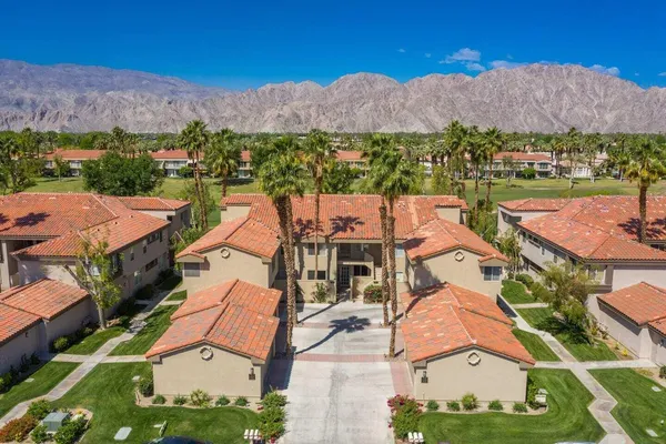 an aerial view of a house with a garden