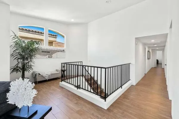a view of entryway with wooden floor