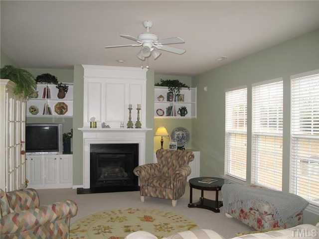 5443 Shaker Heights Lane Raleigh, NC 27613 - Photo 5 of 14 a living room with furniture and a fireplace