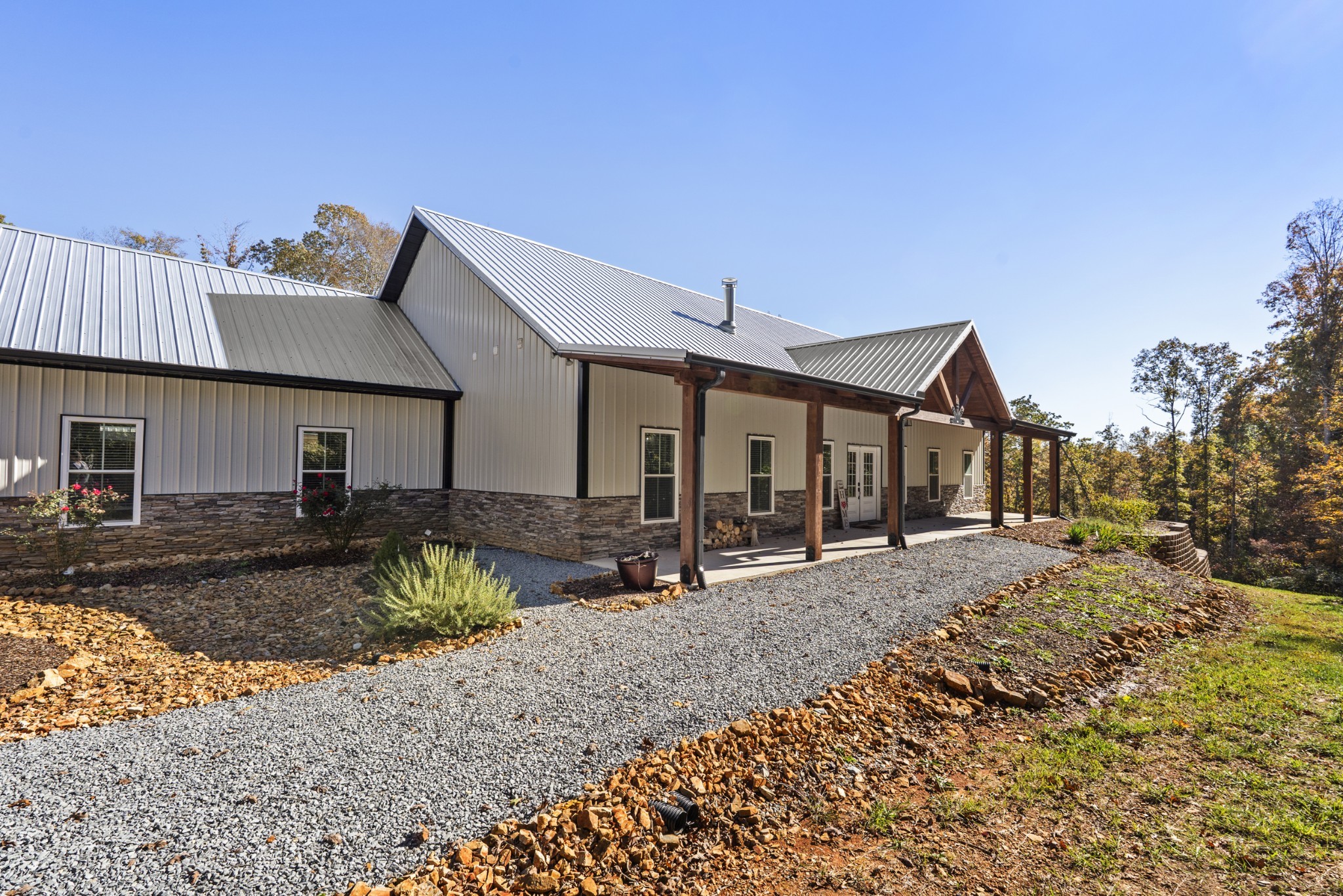 a front view of house with yard outdoor seating and barbeque oven