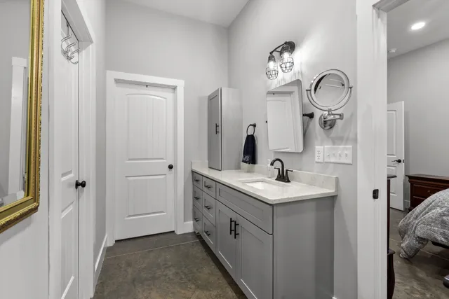 a bathroom with a sink and a mirror