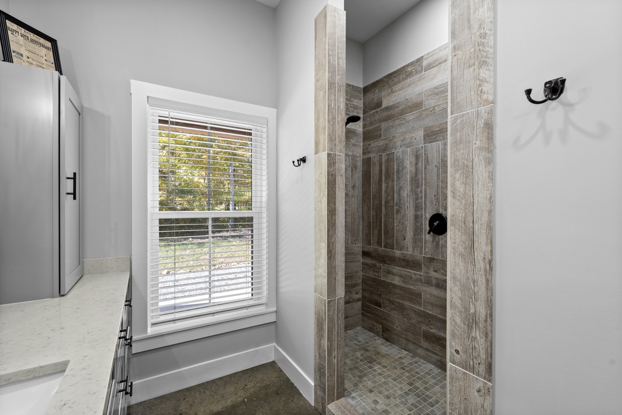 594 Highway 100 Centerville, TN 37033 - Photo 18 of 40 a bathroom with a shower and a window