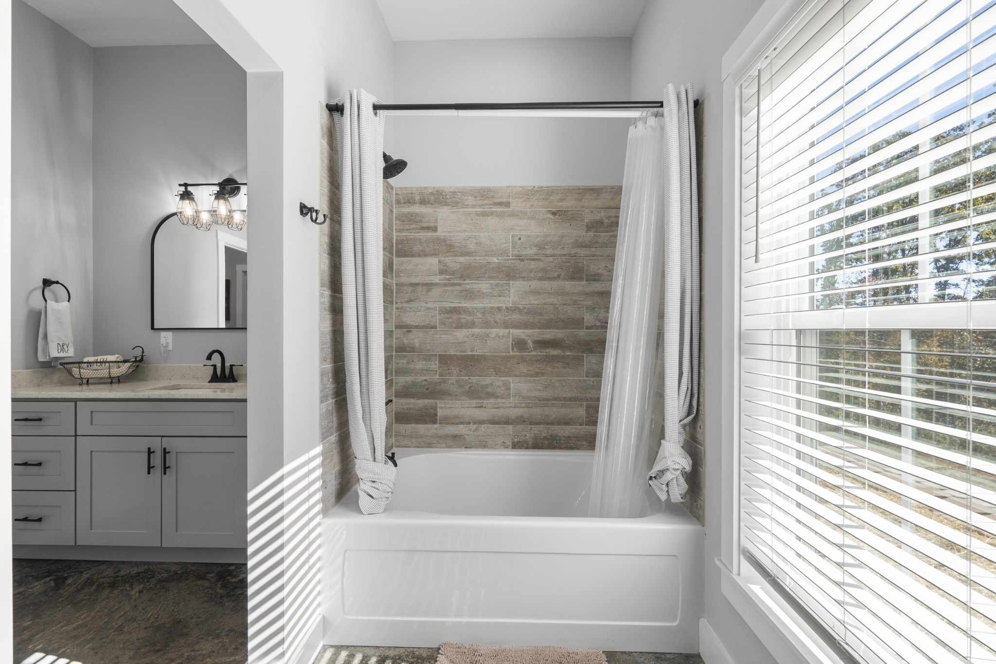 594 Highway 100 Centerville, TN 37033 - Photo 21 of 40 a bathroom with a bathtub and a shower