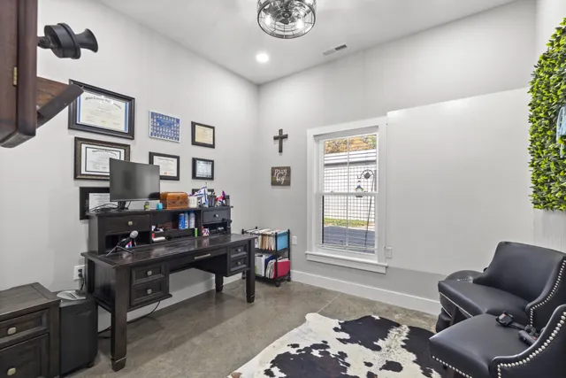 a bedroom with furniture and a window