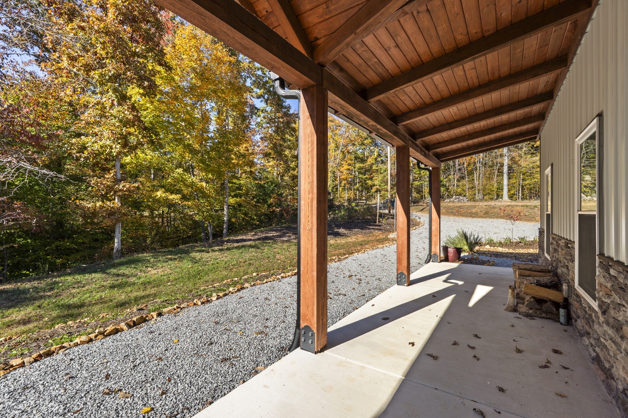 594 Highway 100 Centerville, TN 37033 - Photo 4 of 40 a view of a porch with wooden floor and a yard