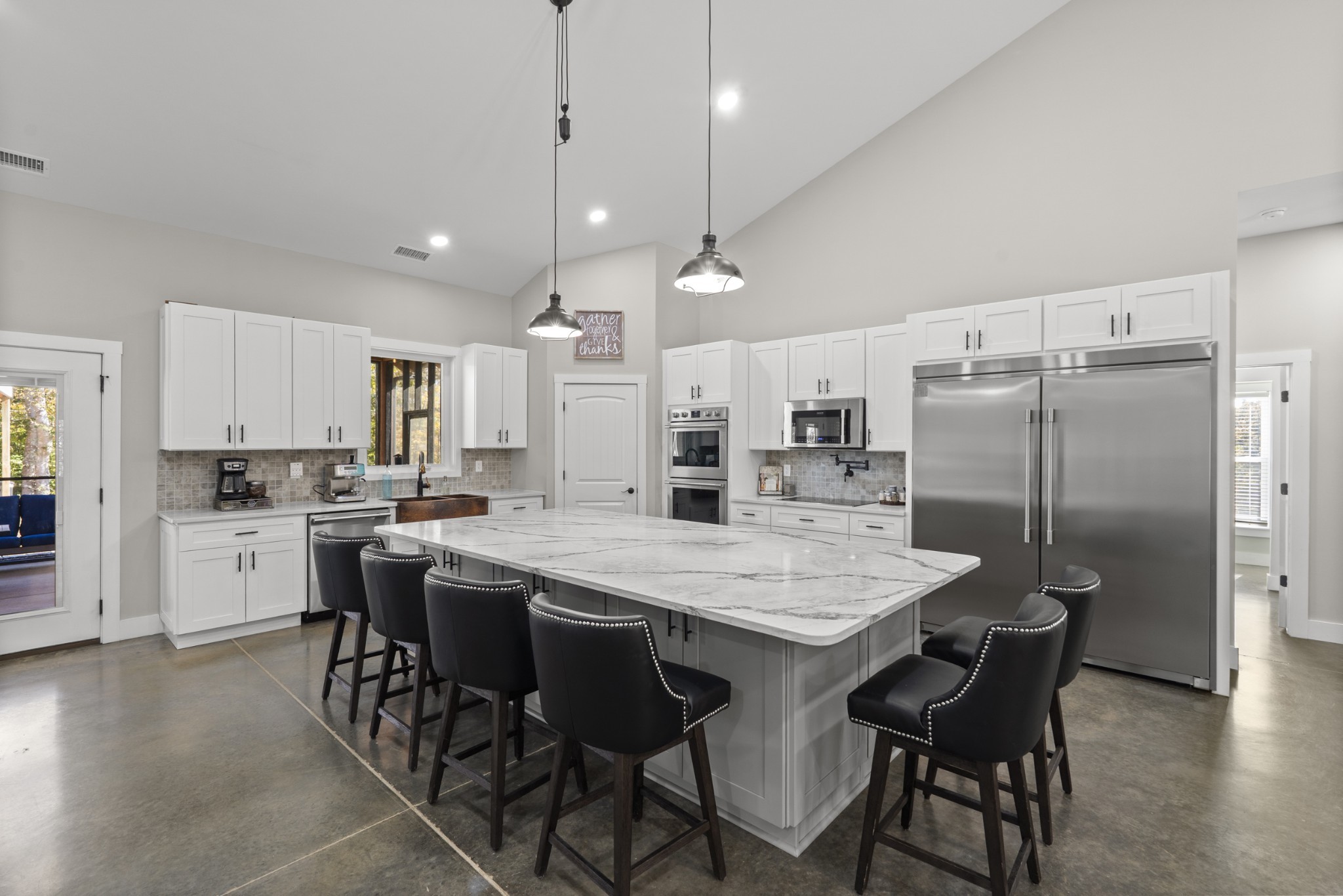 594 Highway 100 Centerville, TN 37033 - Photo 7 of 40 a large kitchen with a table and chairs