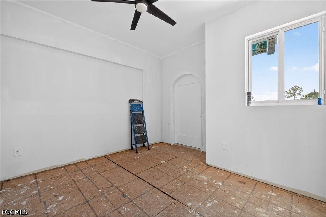2665 Oil Well Road Naples, FL 34120 - Photo 26 of 40 a bedroom with a bed and a window