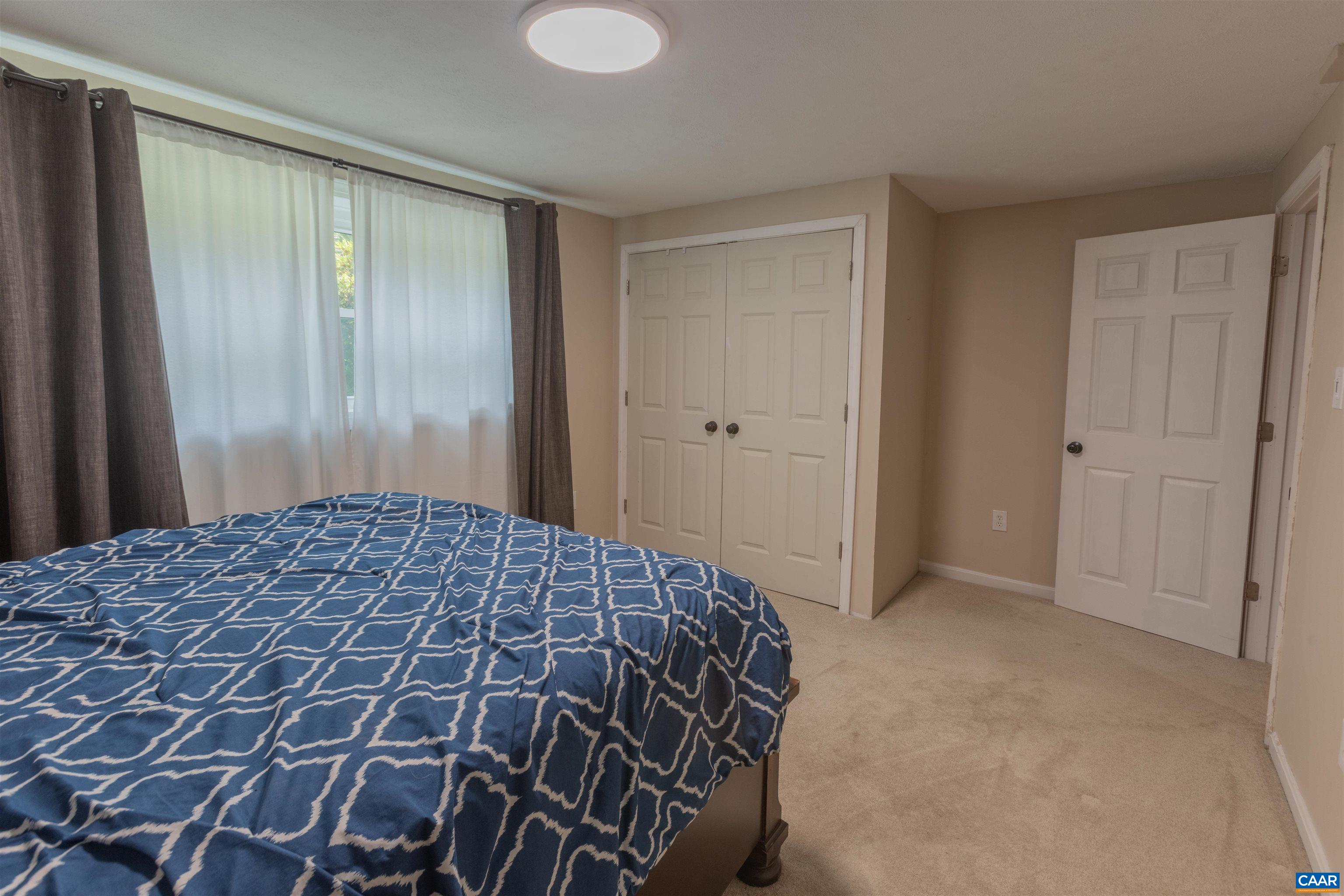 2550 Proffit Road Charlottesville, VA 22911 - Photo 18 of 41 a bedroom with a bed and a window