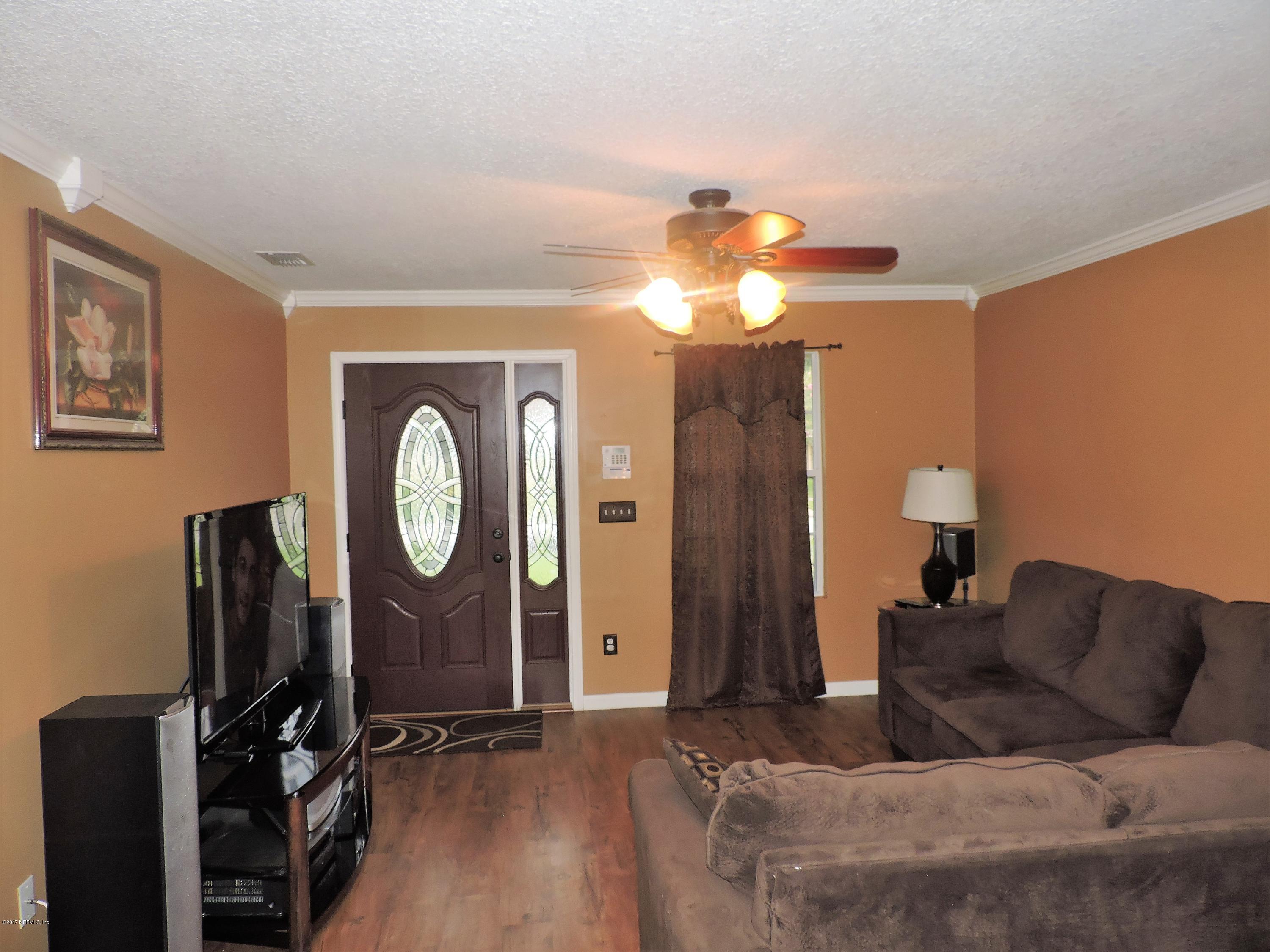 10142 Agave Road Jacksonville, FL 32246 - Photo 4 of 19 family room 2