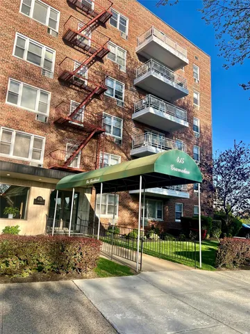 a view of a brick building with a large windows