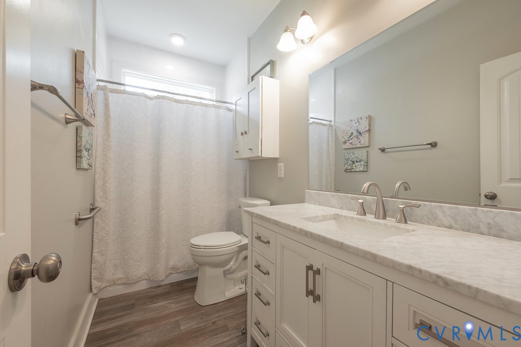 6446 Chestnut Church Road Mechanicsville, VA 23116 - Photo 27 of 49 Bathroom featuring a white vanity with an integrat