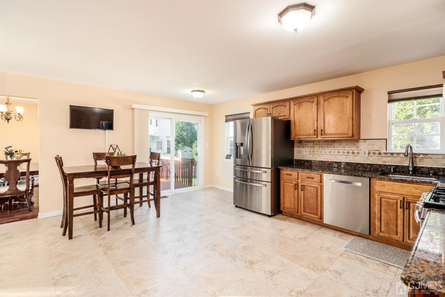 14 Pointer Place Kendall Park, NJ 08824 - Photo 15 of 34 a kitchen with stainless steel appliances a refrigerator stove microwave and white cabinets