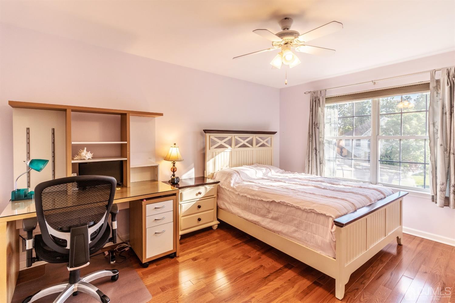 14 Pointer Place Kendall Park, NJ 08824 - Photo 21 of 34 a bedroom with a bed and a chandelier