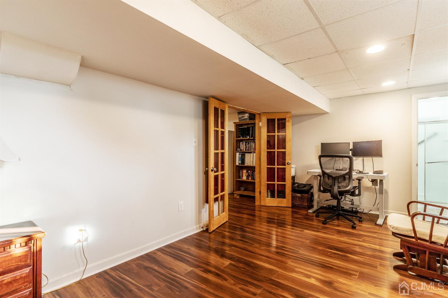 14 Pointer Place Kendall Park, NJ 08824 - Photo 30 of 34 a view of a room with wooden floor and furniture