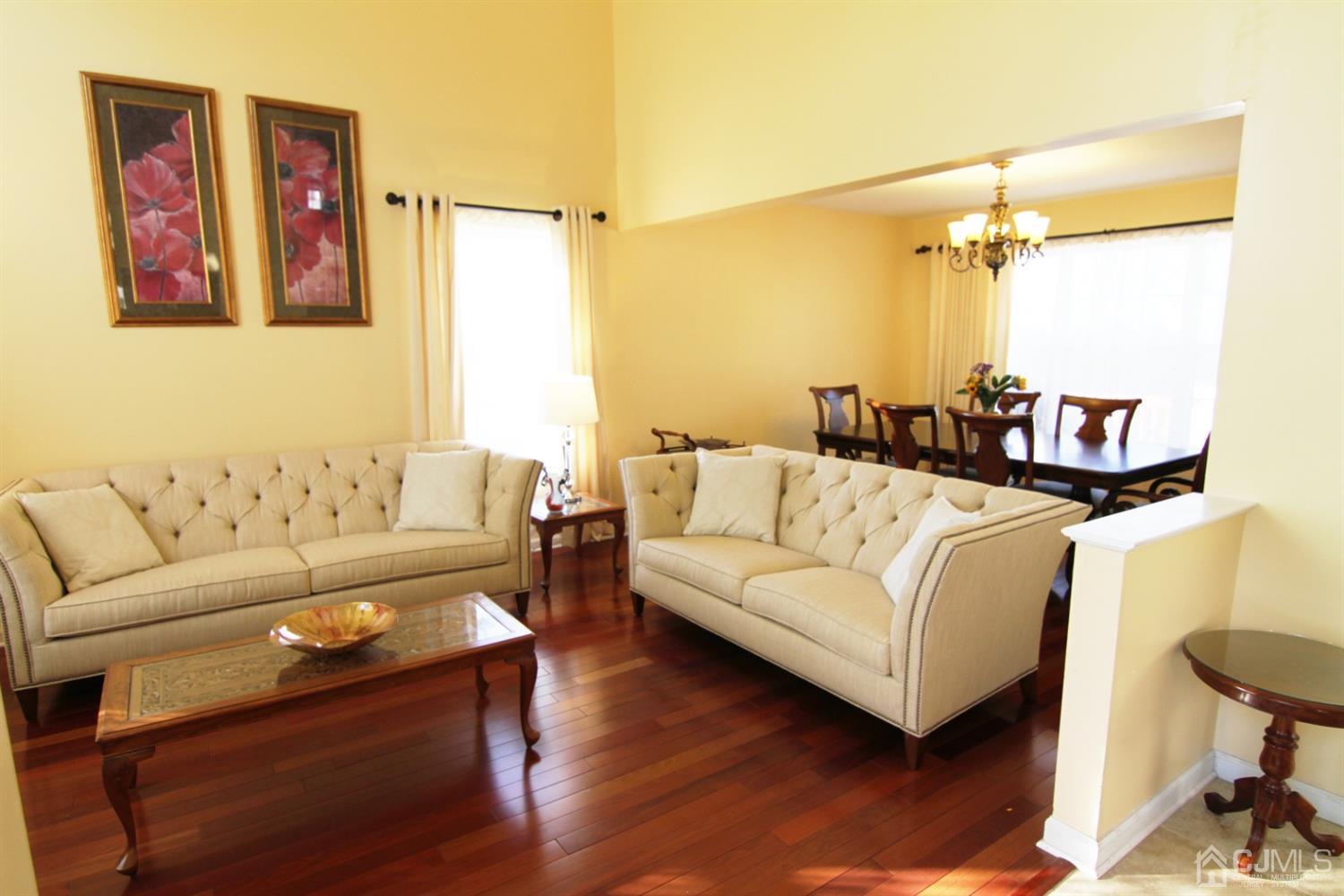 14 Pointer Place Kendall Park, NJ 08824 - Photo 7 of 34 a living room with furniture and a wooden floor