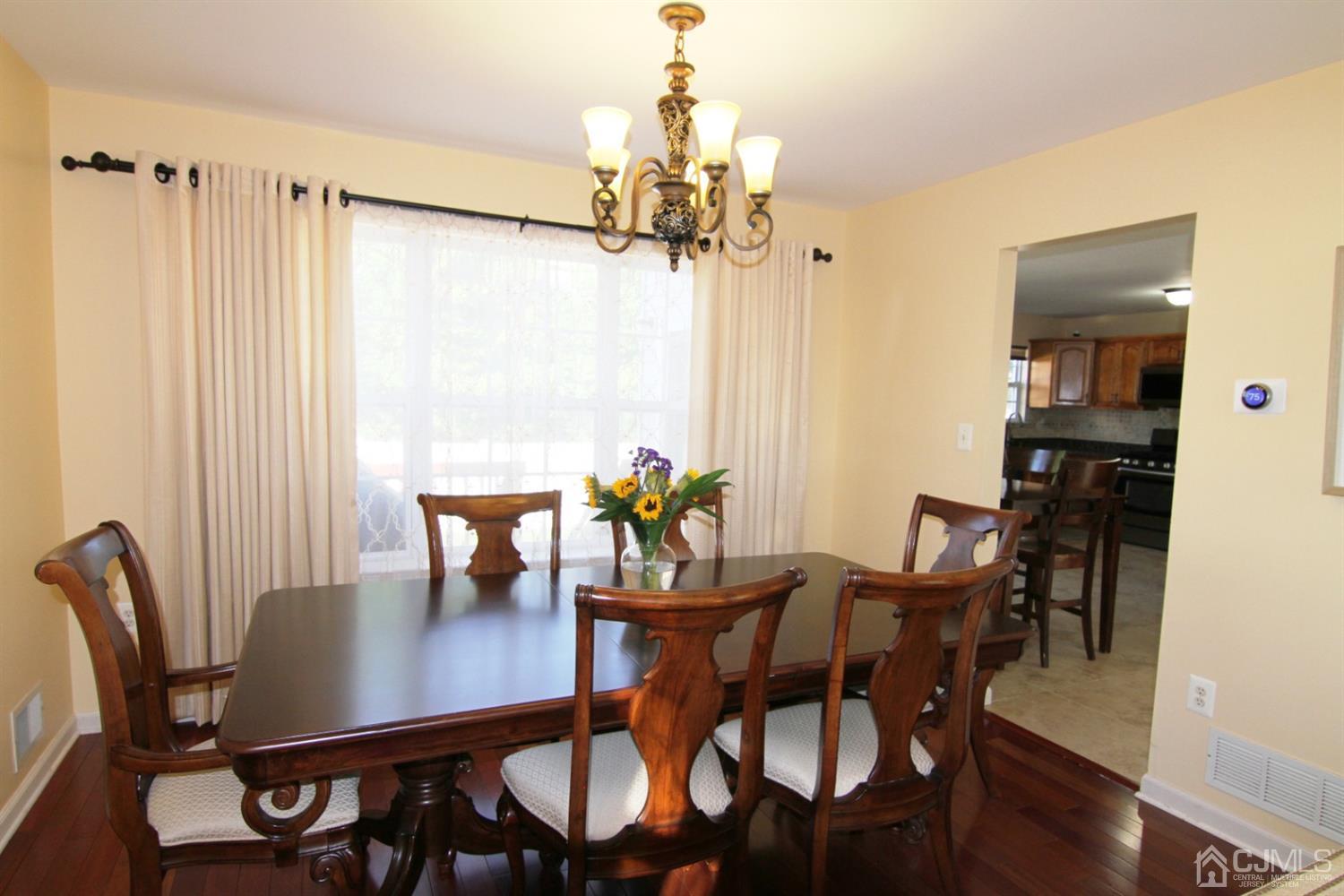 14 Pointer Place Kendall Park, NJ 08824 - Photo 10 of 34 a view of a dining room with furniture window and wooden floor