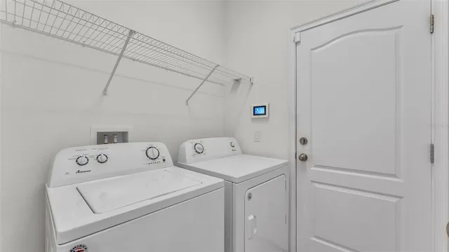 a utility room with dryer and washer