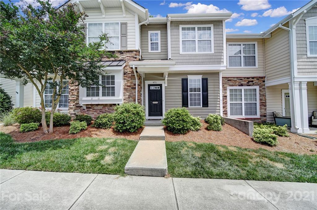 971 Copperstone Lane Fort Mill, SC 29708 - Photo 1 of 26 a front view of a house with garden and porch