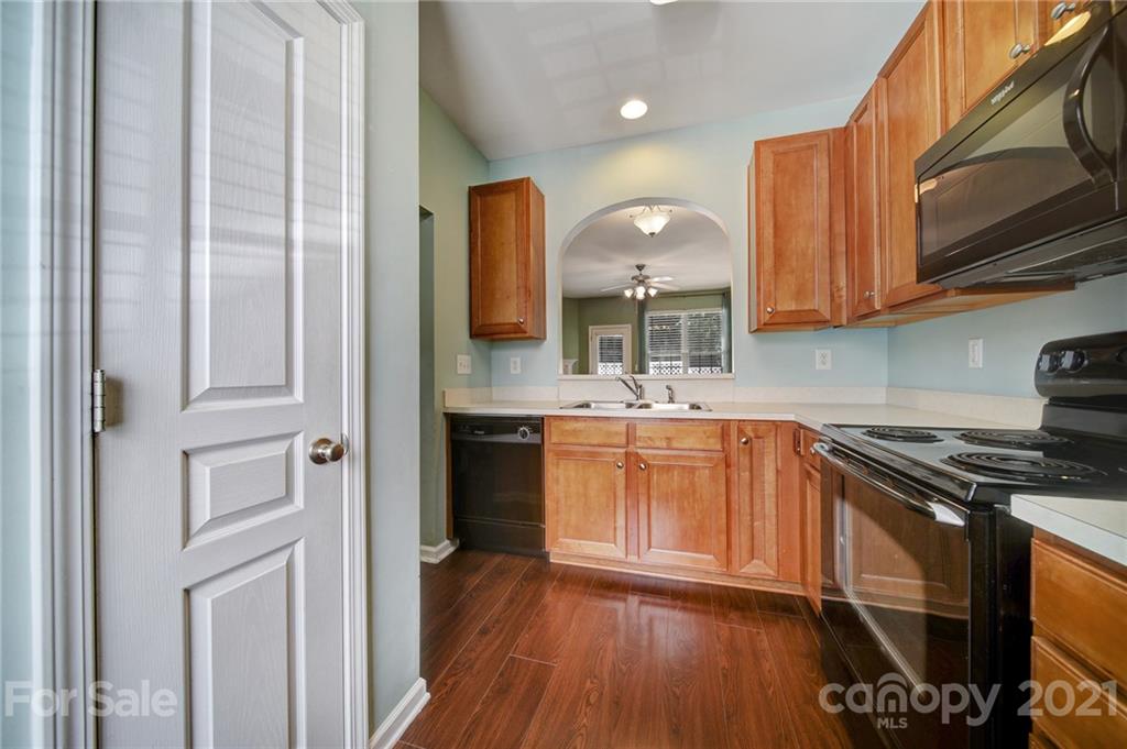 971 Copperstone Lane Fort Mill, SC 29708 - Photo 11 of 26 a kitchen with stainless steel appliances granite countertop a stove a sink and a refrigerator
