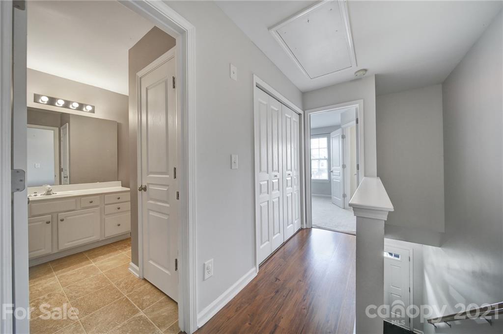 971 Copperstone Lane Fort Mill, SC 29708 - Photo 13 of 26 a view of a hallway with wooden floor windows and cabinet