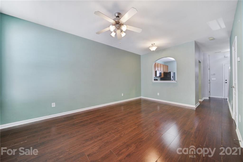971 Copperstone Lane Fort Mill, SC 29708 - Photo 8 of 26 a view of an empty room with window and wooden floor