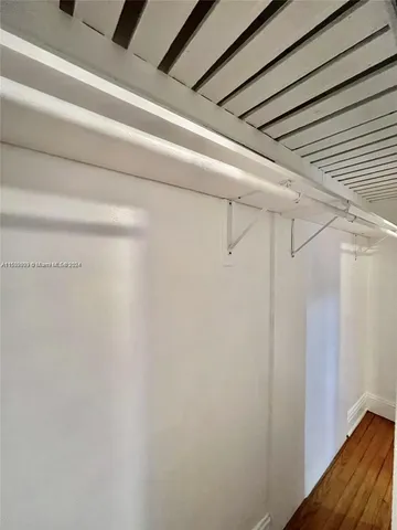 a utility room with cabinets washer and dryer