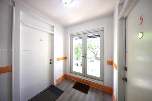 a hallway with wooden floor