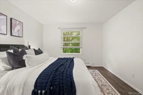 a bedroom with bed and a window