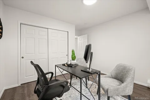 a workspace with furniture and a potted plant