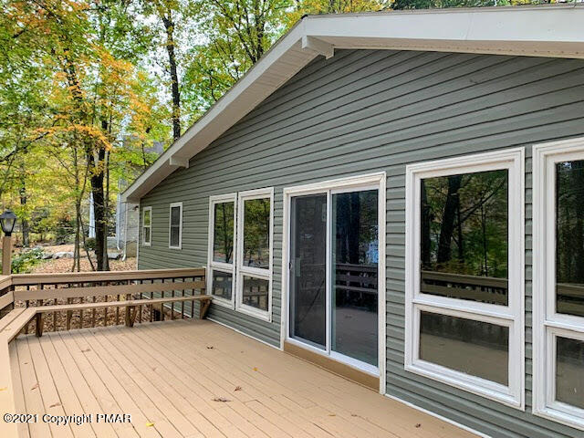 285 Powder Horn Road Henryville, PA 18332 - Photo 3 of 24 a house with wooden floor and outdoor space