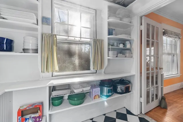 a kitchen with a window and refrigerator