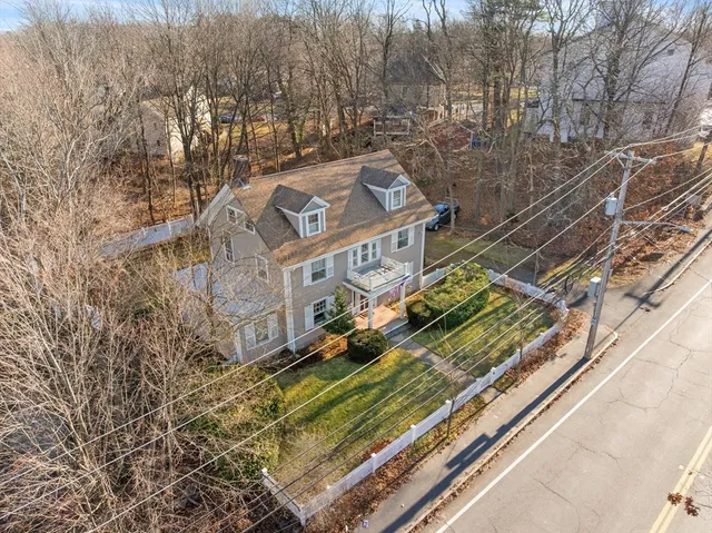 a view of a large building with a yard