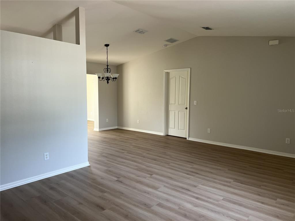 6035 Southwest 98th Street Road Ocala, FL 34476 - Photo 4 of 15 wooden floor in an empty room