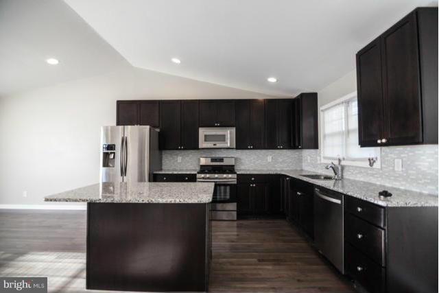 3323 Southgreen Road Baltimore, MD 21244 - Photo 2 of 25 a kitchen with stainless steel appliances granite countertop a sink a stove top oven a refrigerator and a oven