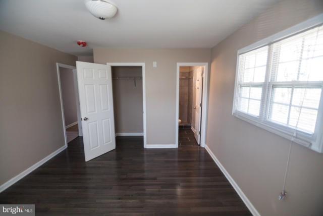 3323 Southgreen Road Baltimore, MD 21244 - Photo 12 of 25 wooden floor in an empty room with a window