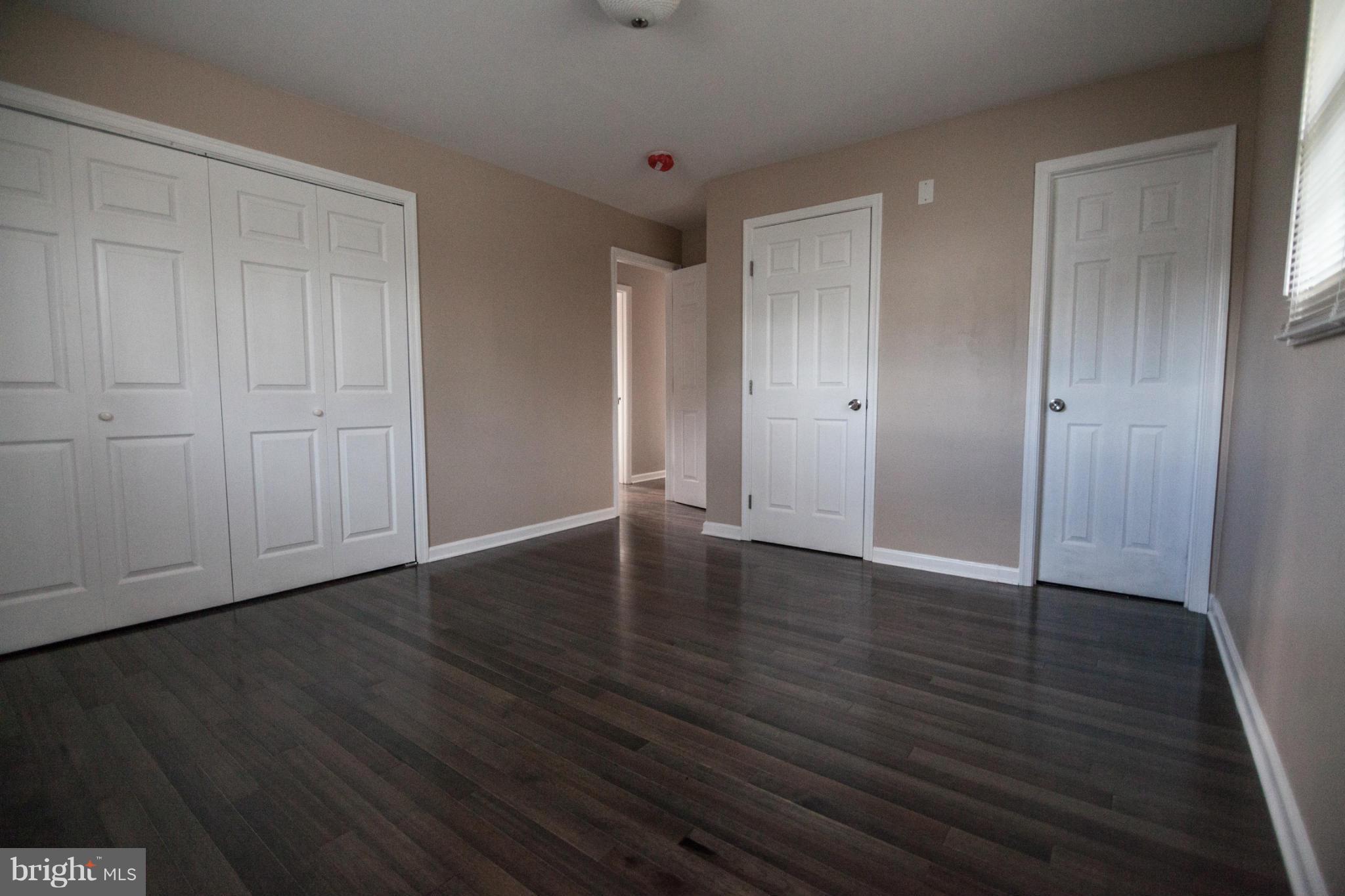 3323 Southgreen Road Baltimore, MD 21244 - Photo 15 of 25 a view of an empty room with wooden floor
