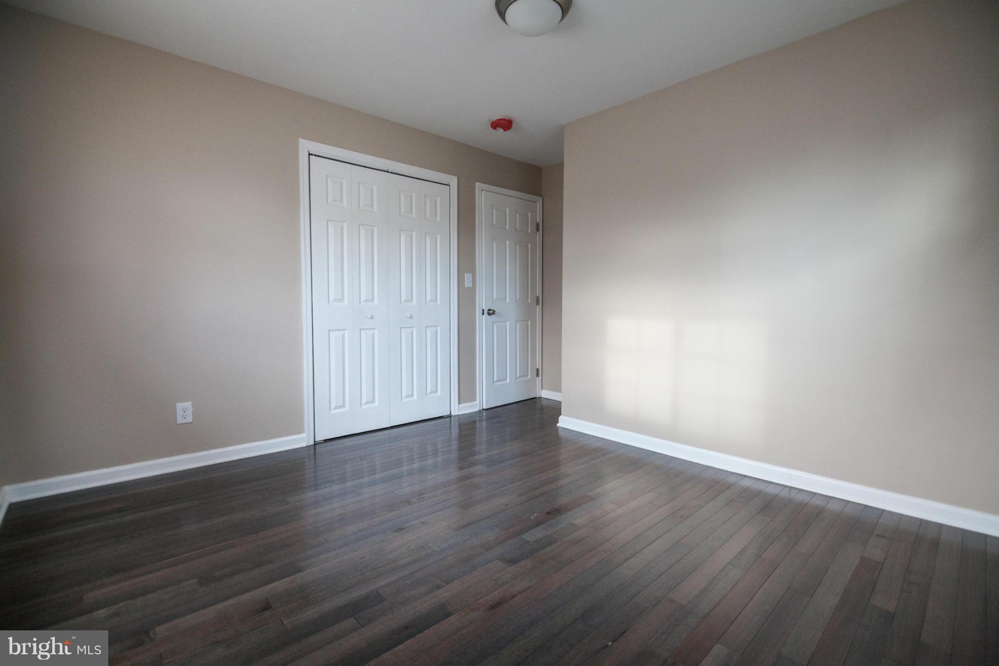 3323 Southgreen Road Baltimore, MD 21244 - Photo 16 of 25 a view of an empty room with wooden floor