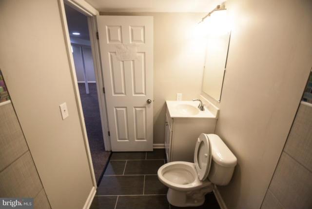 3323 Southgreen Road Baltimore, MD 21244 - Photo 20 of 25 a bathroom with a sink and toilet