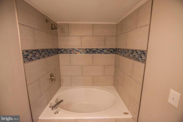3323 Southgreen Road Baltimore, MD 21244 - Photo 21 of 25 a bathroom with a bath tub