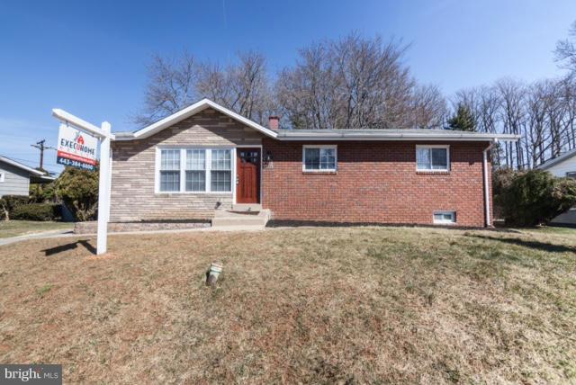 3323 Southgreen Road Baltimore, MD 21244 - Photo 25 of 25 a front view of a house with a yard and garage