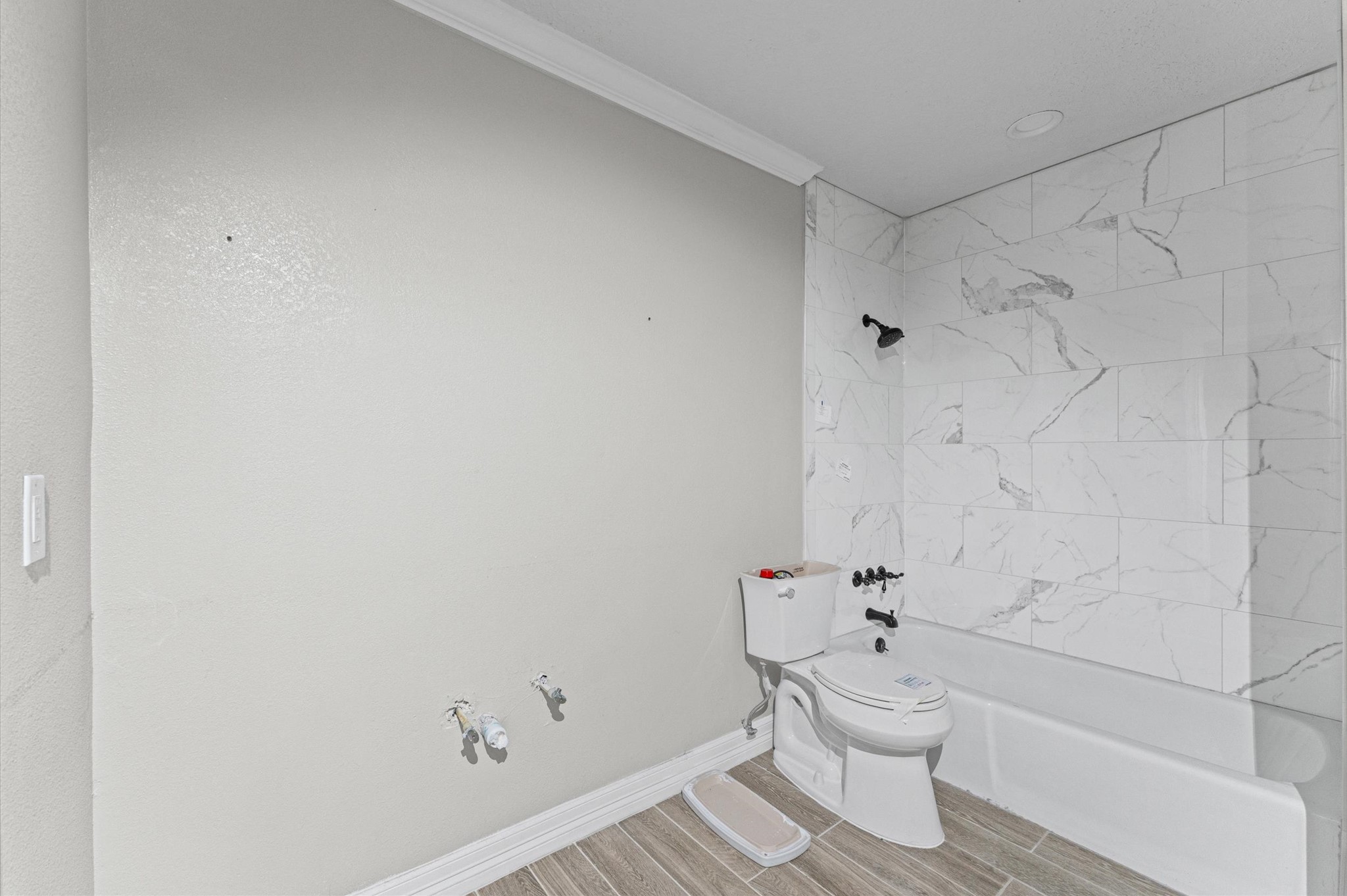 2702 Crowell Lane Baytown, TX 77521 - Photo 14 of 26 a bathroom with a toilet and a shower