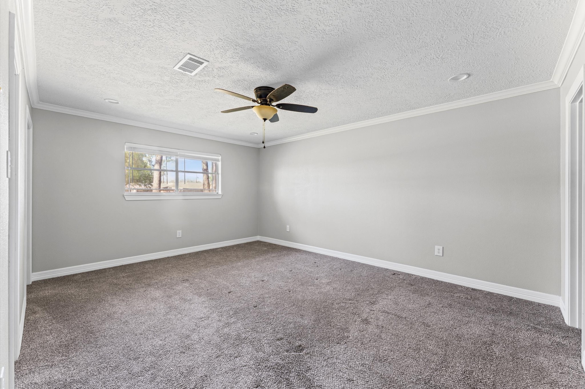 2702 Crowell Lane Baytown, TX 77521 - Photo 17 of 26 a view of an empty room with a window