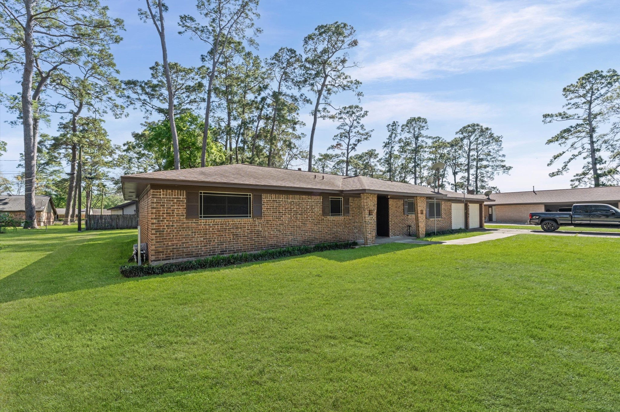 2702 Crowell Lane Baytown, TX 77521 - Photo 2 of 26 a front view of a house with garden