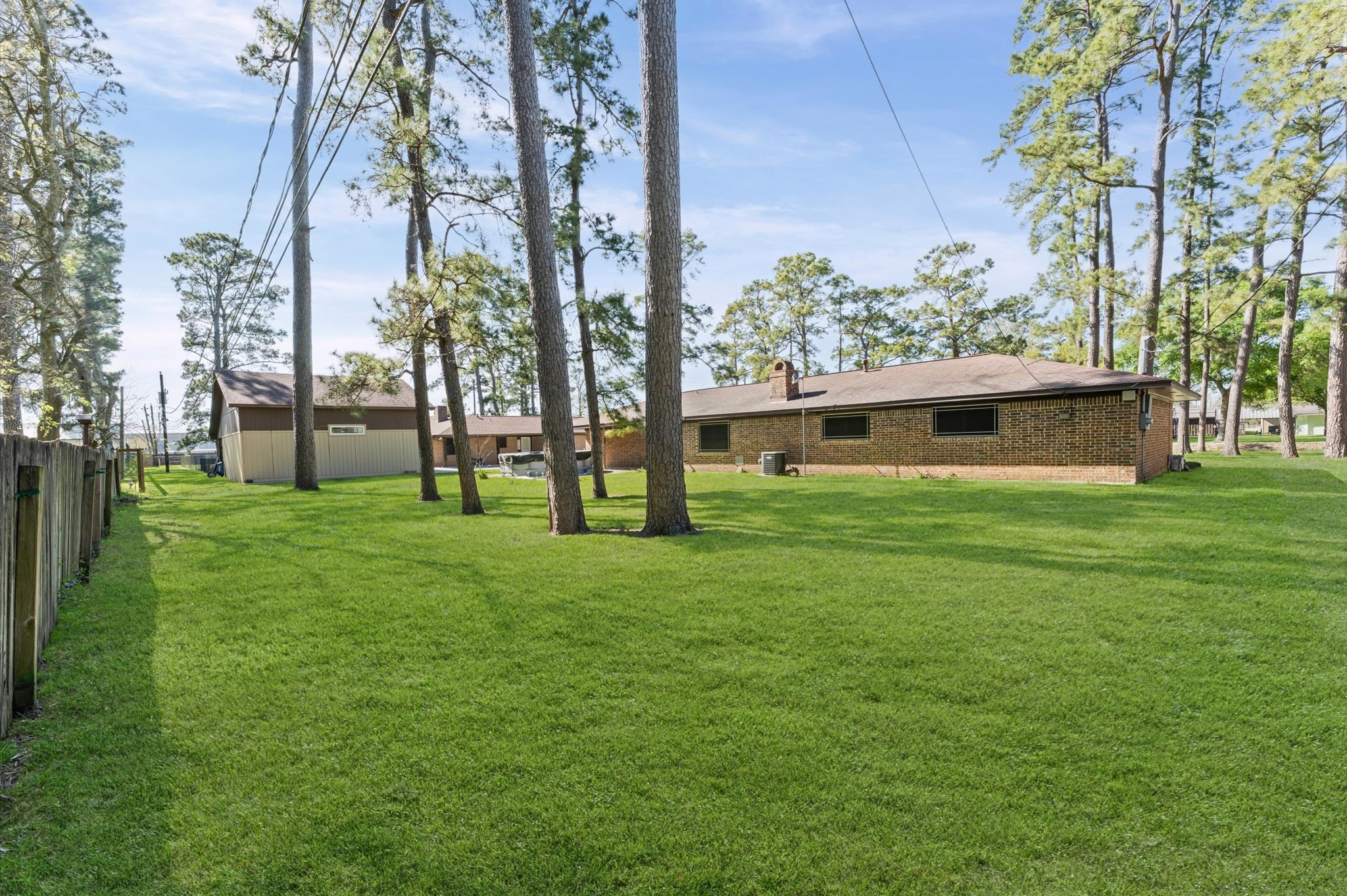2702 Crowell Lane Baytown, TX 77521 - Photo 23 of 26 a view of house with garden and trees