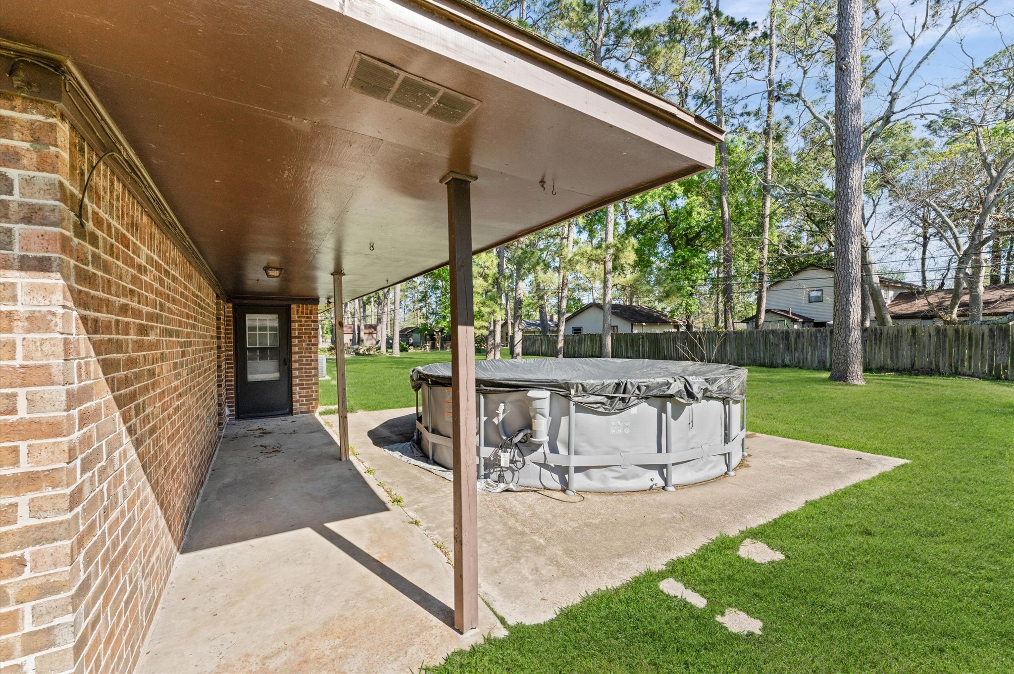 2702 Crowell Lane Baytown, TX 77521 - Photo 25 of 26 a view of a patio with a table and chairs