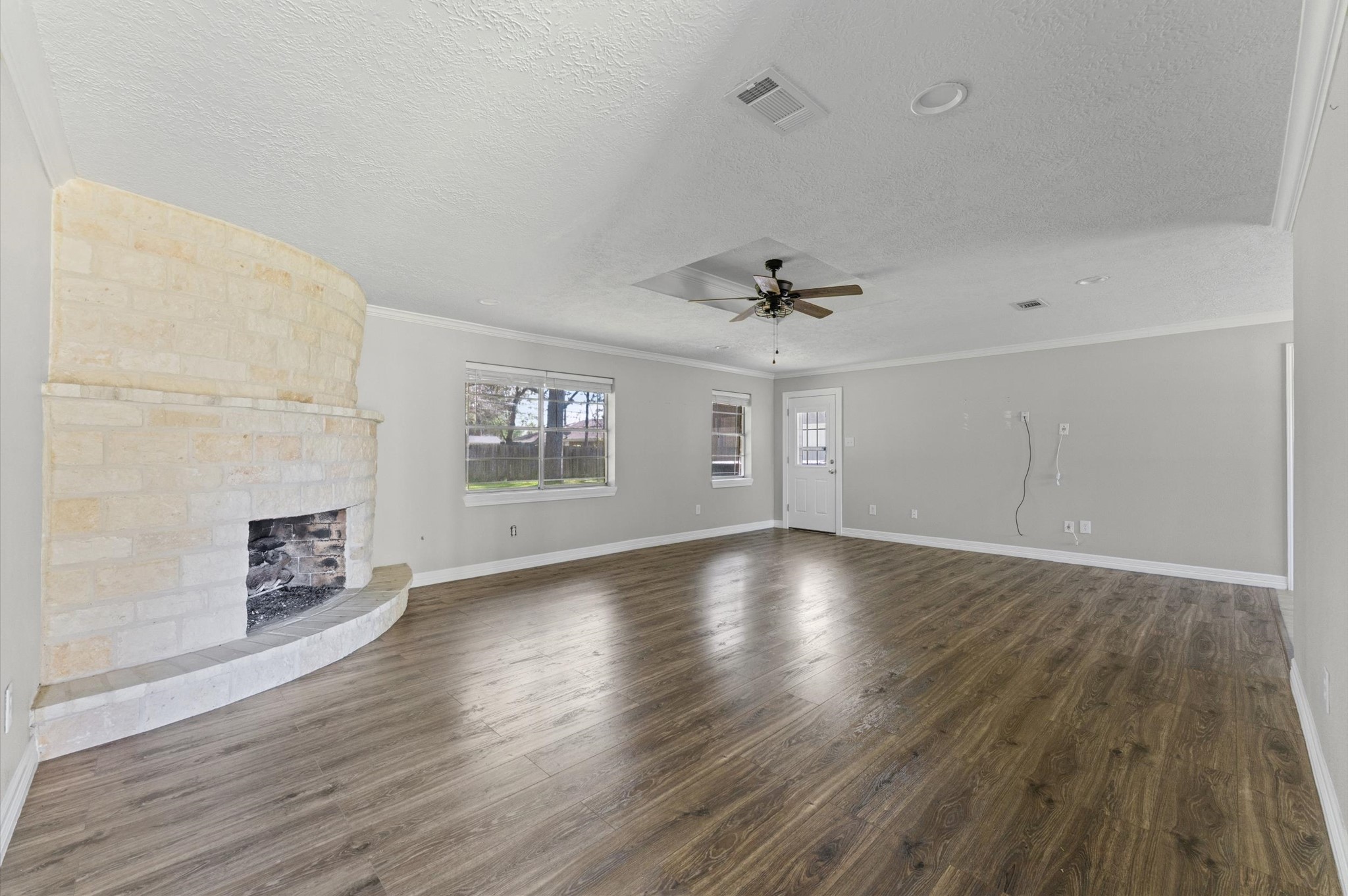 2702 Crowell Lane Baytown, TX 77521 - Photo 6 of 26 wooden floor in an empty room with a window