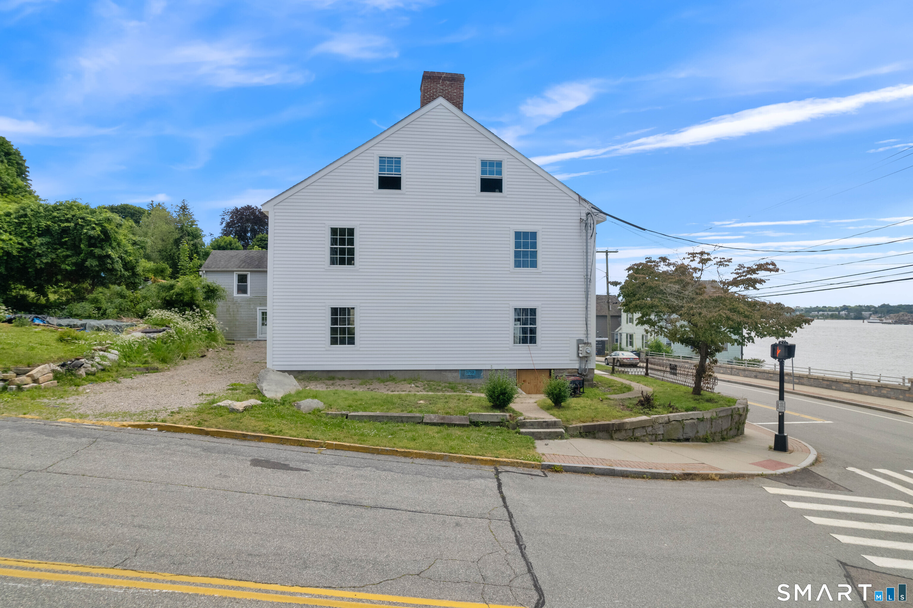 108 Thames Street Groton, CT 06340 - Photo 17 of 40 a front view of a house with a yard